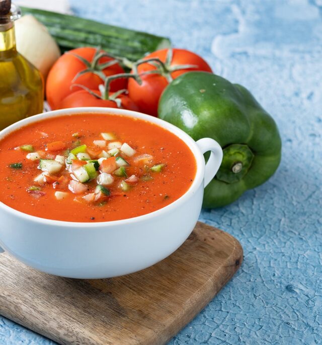 with vegetables in the background gazpacho soup
