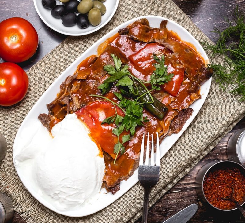 iskender kebab on the table with yogurt