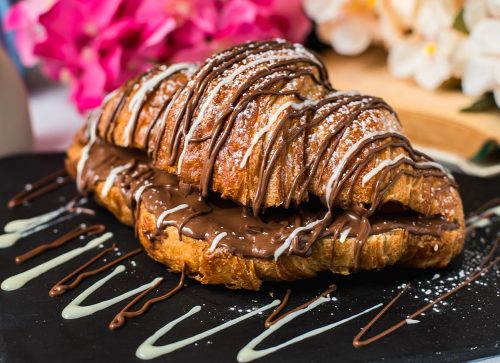 croissant decorated with chocolate
