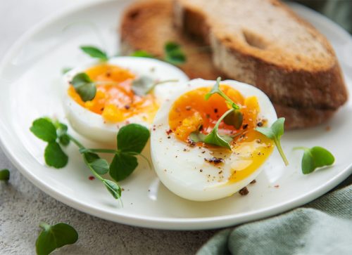 boiled eggs garnished with greens